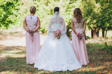 Fototapeta premium Close up of bride and bridesmaids bouquets
