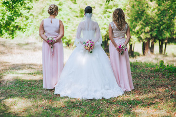 Fototapeta premium Close up of bride and bridesmaids bouquets