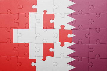 puzzle with the national flag of switzerland and qatar