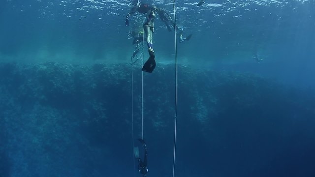 Free divers working out in the open sea