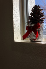 A small Christmas tree by the window