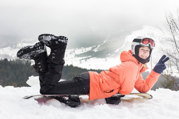 Fototapeta na wymiar Girl with a snowboard