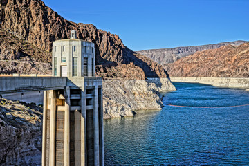 View of building, river, and hills at the Hoover Dam