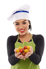Woman cook with a bunch of cherry tomatoes