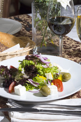 Greek salad on a white background in the restaurant