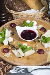 cheese plate with a large decorated the assortment of mint