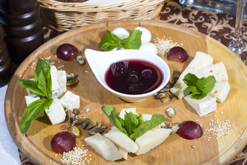 cheese plate with a large decorated the assortment of mint