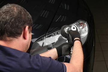 Car service. Polishing of optics of the car