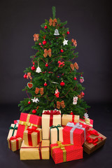 Christmas Tree with Gifts isolated on black
