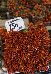 Fototapeta premium fruit and vegetable open air market in Italy - hot chili peppers