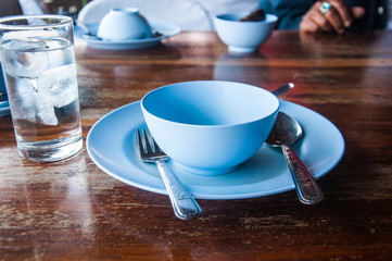 Empty Thai dish on wooden table