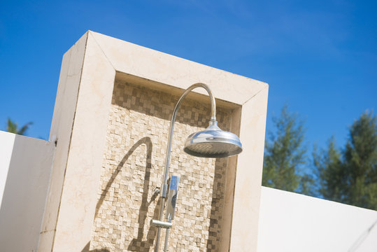 Outdoor Shower Head With Brick Wall