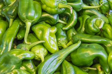 Green pepper at farmers market stall.