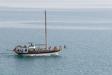Fototapeta premium Pleasure boat on the background of the water surface