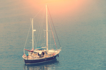 Fototapeta premium Boat with flagpole on the water surface