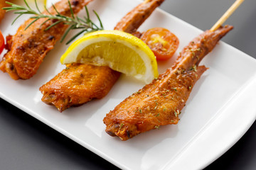 Fresh made chicken wing satay skewer