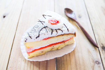 Piece of Vanilla Cake on wood table