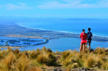 Tourist couple look at the landscape view of Christchurch - New