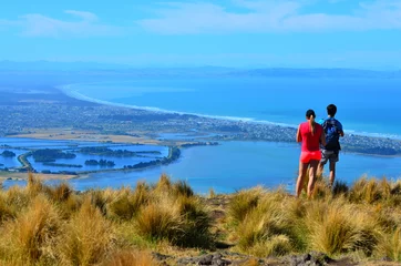 Fototapete Neuseeland Tourist couple look at the landscape view of Christchurch - New