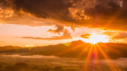 Obraz na płótnie Canvas Mountains and mist with sunrise time in Thailand