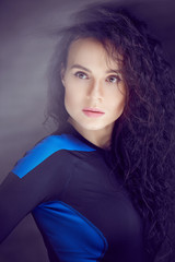 Fototapeta premium Portrait of brunette woman in sportswear.