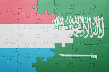 puzzle with the national flag of saudi arabia and luxembourg