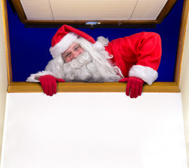Naklejka premium Santa Claus climbs into the room through an open window