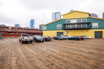 skyline and wooden parking lot front of building