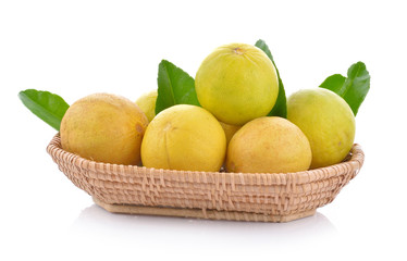 ripe lime in the basket on white background