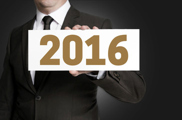 2016 sign is held by businessman concept