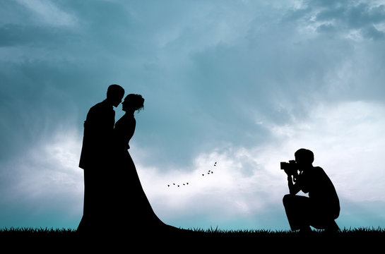 Wedding photographer service at sunset