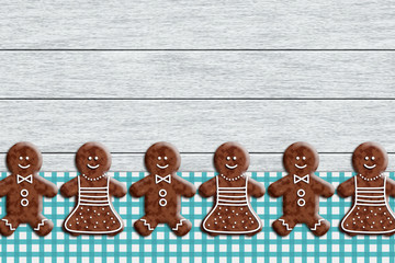 gingerbread cookies lying on wooden desk - obrazy, fototapety, plakaty