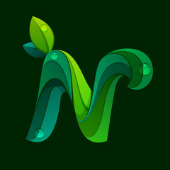 N letter logo formed by green leaves.