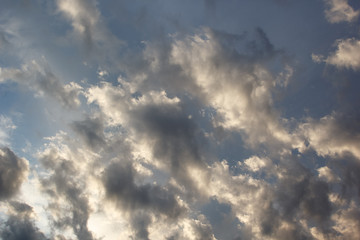 Naklejka na ściany i meble cumulus clouds in evening sky before sunset