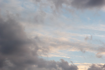 cumulus clouds in evening sky before sunset