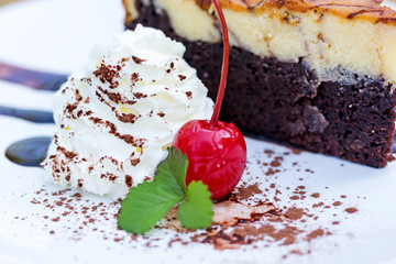 Chocolate Cake with cream cheese on a wood background