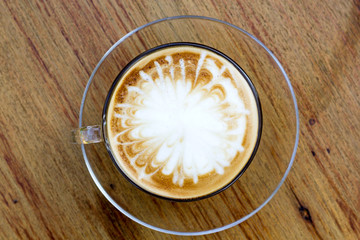 Hot coffee in a white cup on table