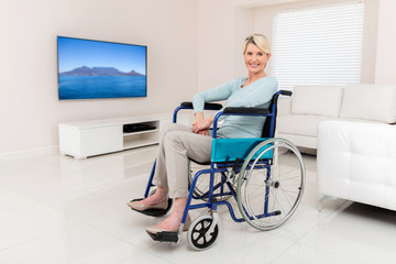 Fototapeta na wymiar disabled middle aged woman sitting in living room
