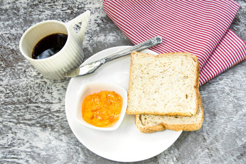 orange marmalade and bread for breakfast