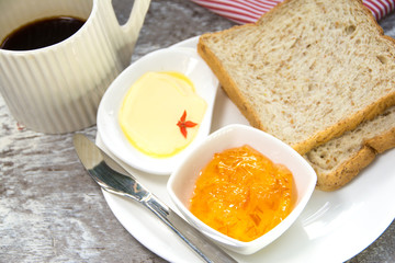 Bread with orange marmalade jam