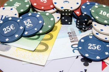 poker chips with playing card, euro note as background