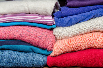 Fototapeta na wymiar stack of clothes from knitted knitwear