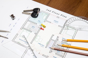architectural drawings with pencil, ruler, compass and keys