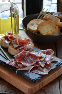 appetizer of ham Serrano with bread roasted