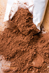cocoa powder on wooden background