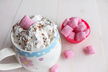 cup of hot chocolate and candy