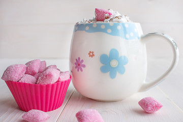 cup of hot chocolate and candy