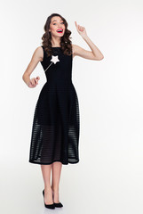 Inspired beautiful woman making a wish and using magic wand