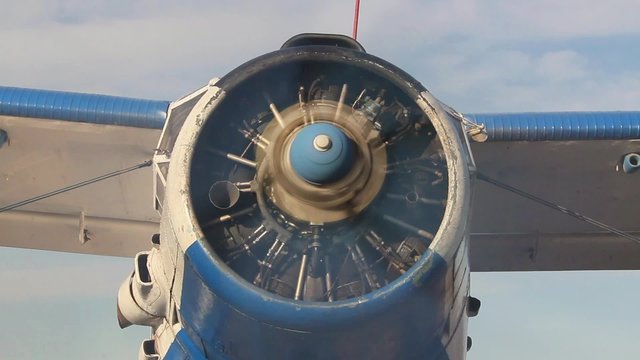 Front view of an old russian biplane with engine running