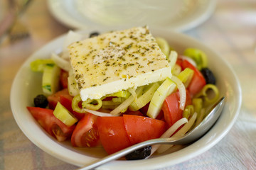Greek salad on the table in the Greek restaurant